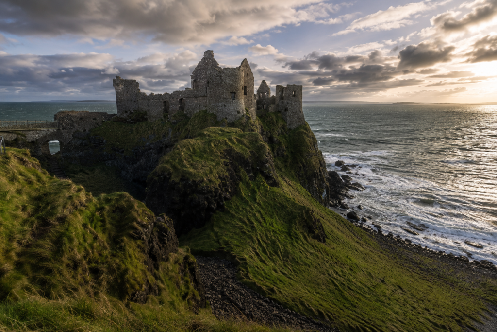Dunluce Castle ruins on a clifftop above the sea on the Antrim coast, Northern Ireland
