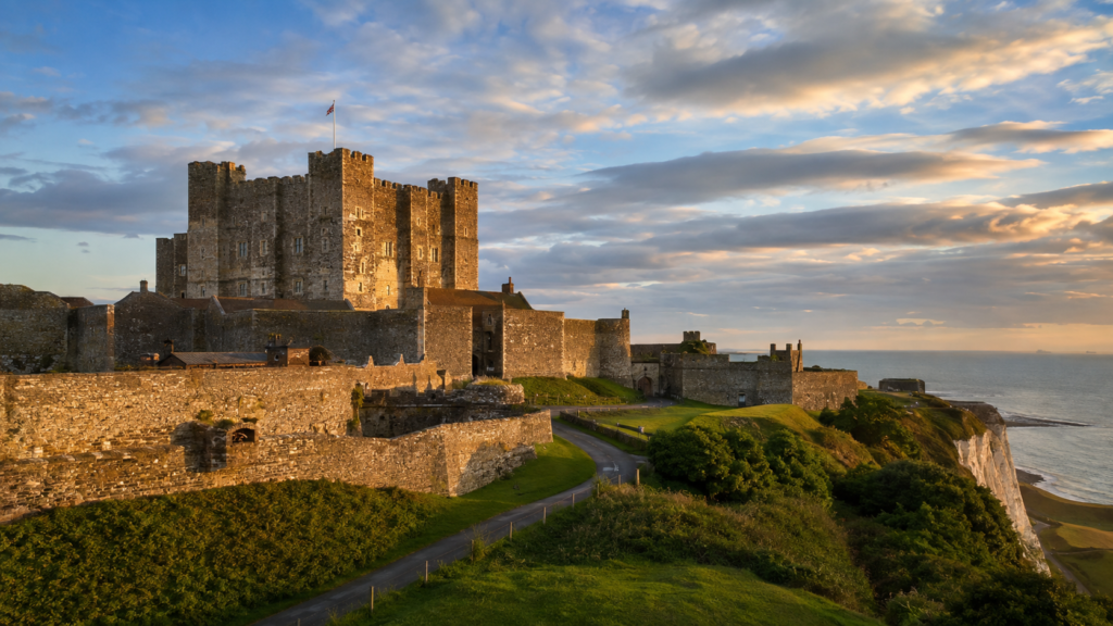 Dover Castle's Norman keep on the White Cliffs of Kent at golden hour